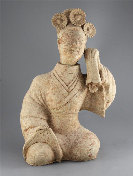 A large Chinese pottery figure of a seated entertainer, Eastern dynasty (25-220AD), 55.5cm